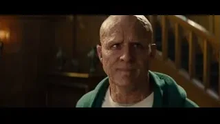 elderly man in green hoodie looking at camera — Deadpool 2