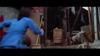 person climbing chain-link fence — Bruce Lee: Enter The Dragon