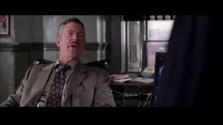 Man sitting in dimly lit office chair — Spider Man 2