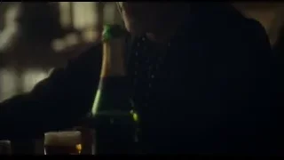 woman with eyes closed holding beer — Peaky Blinders