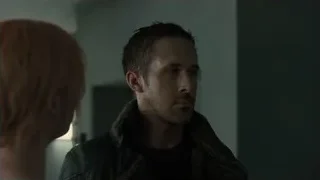 man and woman in dimly lit room — Blade Runner 2049