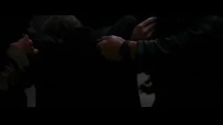 people in dark room with clasped hands — Batman: The Dark Knight Rises