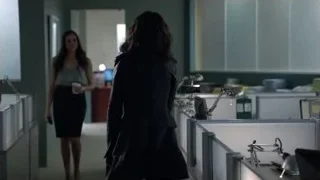 Man and woman standing by office desk — Suits