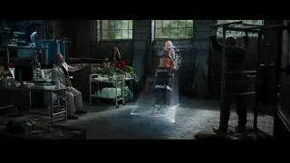 Three people in dark industrial room — Iron Man 3