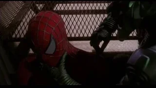 Spider-Man confronting robot holding a gun — Spider Man