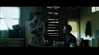 two men conversing in dimly lit kitchen — Fight Club