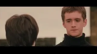young man in black turtleneck smiling at camera — Harry Potter and the Philosophers Stone
