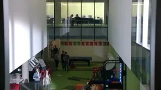 people walking in modern office with pool table — Suits