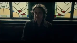 woman sitting by stained glass window — Peaky Blinders
