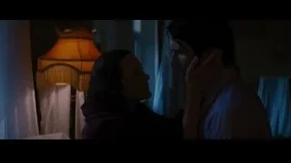 Man and woman kissing in bedroom — Batman: The Dark Knight Rises