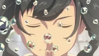 young woman blowing soap bubbles — Weathering with You