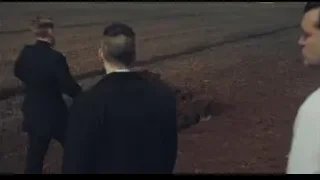 Two men in suits digging in field — Peaky Blinders
