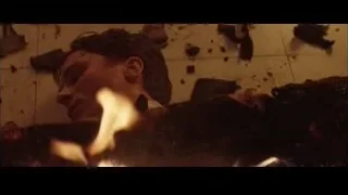 Man lying distressed on rubble — Batman