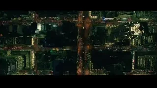 aerial night view of bustling city — John Wick