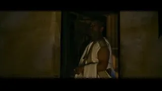 man in white robe standing in dilapidated building — Gladiator 2
