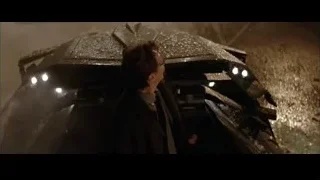 man looking up at large spaceship — Batman
