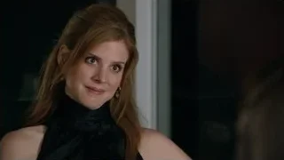 Red-haired woman looking at camera — Suits