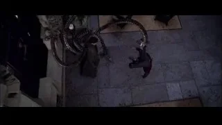 large snake coiled on building at night — Spider Man 2