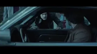 man in car looking concerned — John Wick