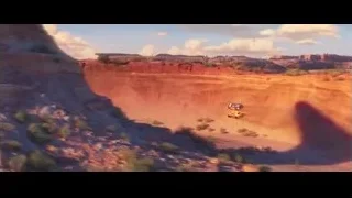 vehicles driving in desert landscape — Cars 3