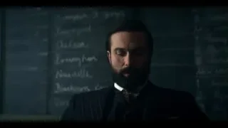 Man with beard in suit by blackboard — Peaky Blinders
