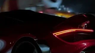 rear of red sports car at night — Sports Cars