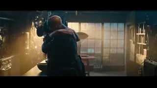 Man and woman embracing in kitchen — Deadpool 2