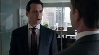 two men in suits conversing in office — Suits