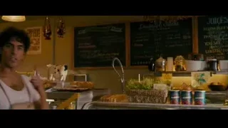 man behind counter in restaurant — The Dictator