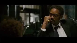 Man in suit talking on phone on bus — The Persuit of Happyness