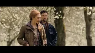 Man and woman standing in forest — Doctor Strange 2