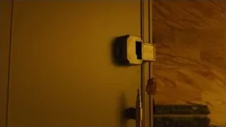man holding metal door in dim room — Blade Runner 2049