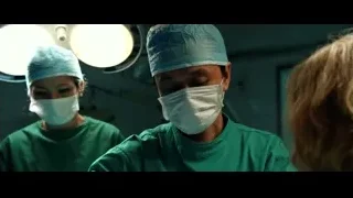 two surgeons performing operation in operating room — Lucy