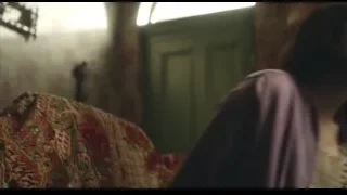 young woman sitting on couch in dark room — Peaky Blinders