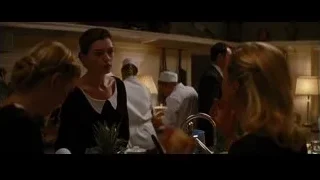 man in suit in kitchen with woman — Batman: The Dark Knight Rises