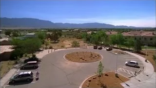 Aerial view of parking lot with circular garden — Breaking Bad
