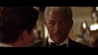older man in tuxedo in dimly lit room — Batman