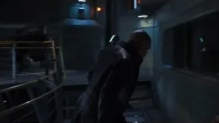 two men in industrial space with futuristic interface — The Avengers