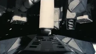 space station with cylindrical object in dark space — Interstellar