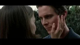 man whispering to woman — Batman