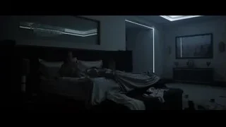 man sitting on bed in bedroom — F1
