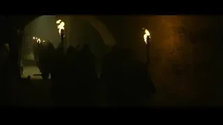 people with torches walking dark tunnel — Gladiator 2