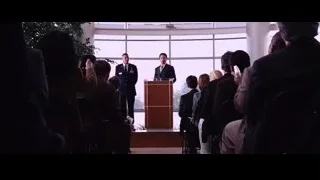 man speaking at podium to audience — Iron Man