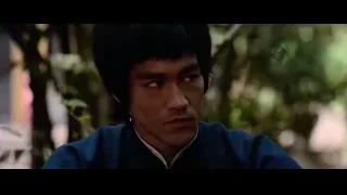 man in blue jacket with serious expression — Bruce Lee: Enter The Dragon