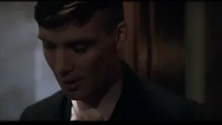 Young man with serious expression in dimly lit room — Peaky Blinders