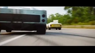 sports car driving on winding road — Ford v Ferrari
