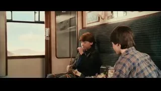 two boys looking at objects on train — Harry Potter and the Philosophers Stone