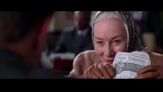 Elderly woman with headscarf reading newspaper — Spider Man 2