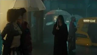 people walking in rainy street at night — Blade Runner 2049