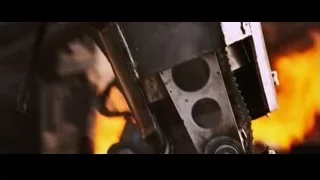robot-like creature in fiery battle — Iron Man